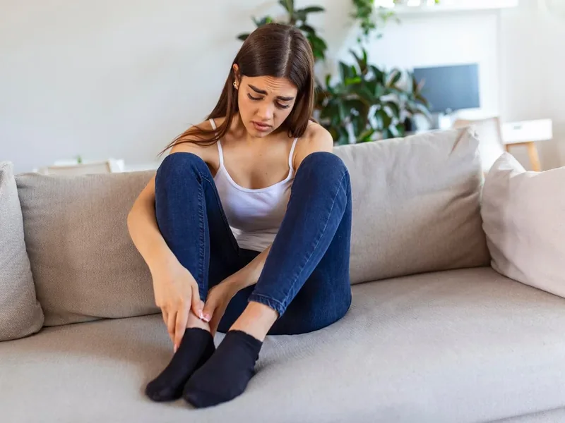 Doctor of Physical Therapy assessing a patient for foot & ankle pain at Amplify Physical Therapy and Wellness