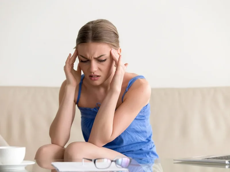 Doctor of Physical Therapy assessing a patient for headaches at Amplify Physical Therapy and Wellness