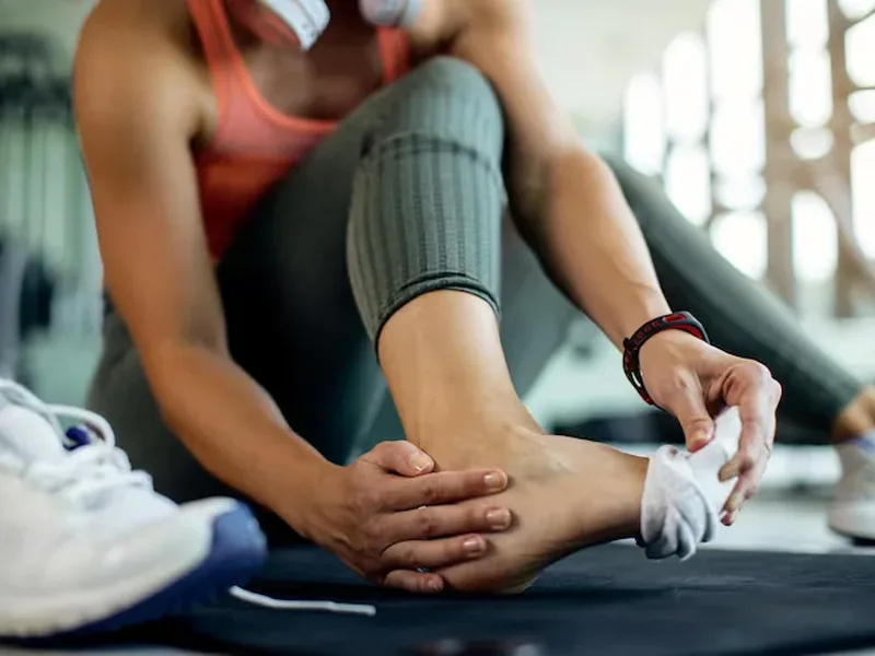 Doctor of Physical Therapy assessing a patient for sports injuries at Amplify Physical Therapy and Wellness