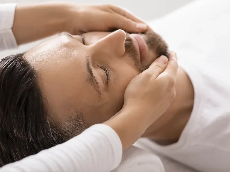 Doctor of Physical Therapy assessing a patient for tmj/tmd at Amplify Physical Therapy and Wellness