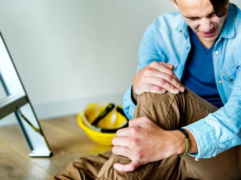 Doctor of Physical Therapy assessing a patient for work injuries at Amplify Physical Therapy and Wellness