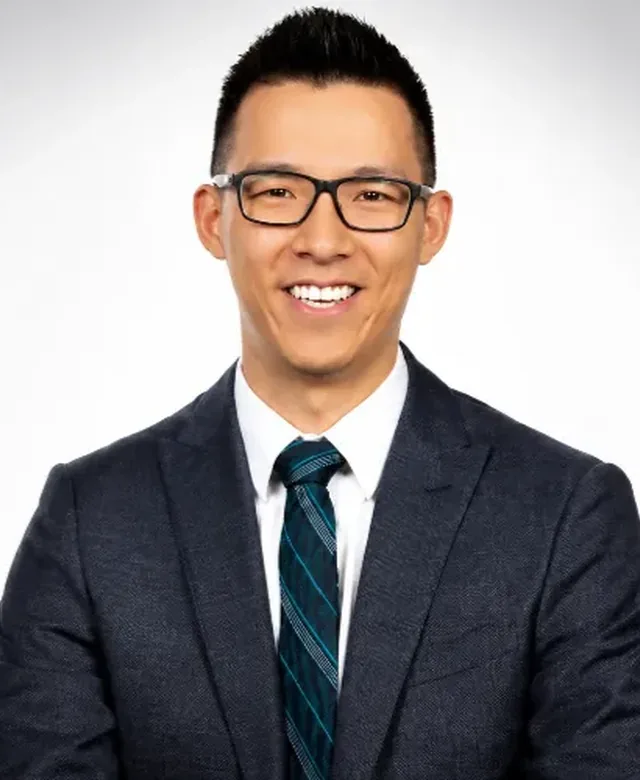 Portrait of Dr. Andrew Moy, PT, DPT, OCS, COMT, owner of Amplify Physical Therapy and Wellness