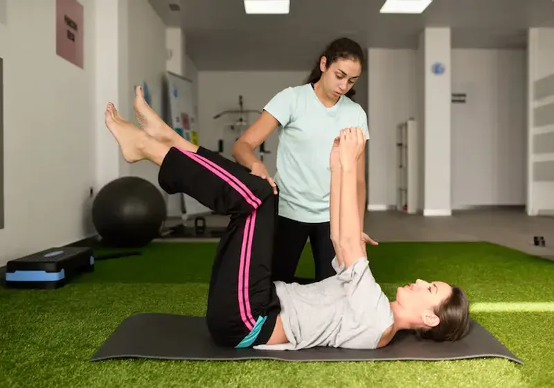 Therapist guiding an older adult through a balance and gaze stability exercise