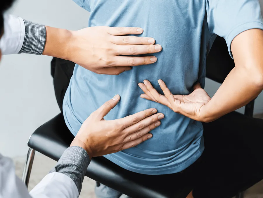 Physical therapist guiding a patient through a one-on-one session