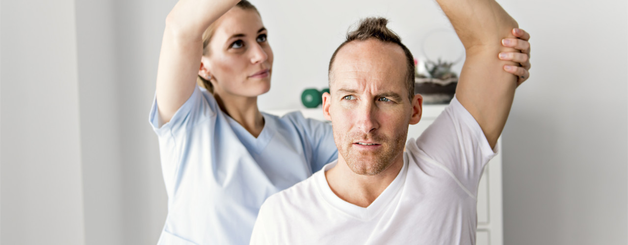 man doing range of motion exercises after his shoulder surgery